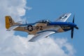 P-51 Mustang Performing Aerobatics at Hill AFB in blue sky