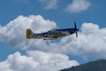 P-51 Mustang Performing Aerobatics at Hill AFB in blue sky