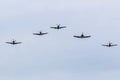 P-51 Mustangs, Supermarine Spitfire, and F4U Corsair in Formation