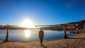 PÃÂ¶rtschach - A girl walking on the lake side, next to a scarecrow