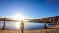 PÃÂ¶rtschach - A girl walking on the lake side, next to a scarecrow