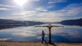 PÃÂ¶rtschach - A girl walking on the lake side, next to a scarecrow