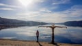 PÃÂ¶rtschach - A girl walking on the lake side, next to a scarecrow