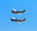 P-40 warhawk and a P-51 Mustang flying together