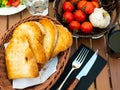 Pa amb tomaquet, traditional Catalan food, served on wooden table. Tomatoes, toasts and garlic bulb.