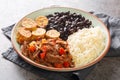 Pabellon criollo is a traditional dish of Venezuela with black beans, rice, plantains and shredded steak that have been cooked