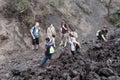 PACAYA, GUATEMALA - MAR 28, 2016: Tourists at the lava field of Pacaya volcano, Guatema