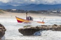 Dory Boat approaches landing on beach