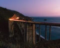 Light trails over ocean bridge