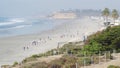 Pacific ocean beach Del Mar, California USA. Students pupil children running. Athletic sport workout