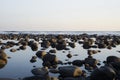 Pacific Ocean coast in El Salvador. Reflection of rocks or stones in the water Royalty Free Stock Photo