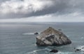 Pacific Ocean and Rocks in the Water. Next to California State Road 1. Cloudy Stormy Sky in Background. Wild Nature Royalty Free Stock Photo