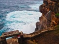 Pacific Ocean Storm Waves Crashing on Sandstone Cliff, Australia Royalty Free Stock Photo