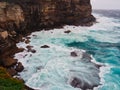 Pacific Ocean Storm Waves Crashing on Sandstone Cliff, Australia Royalty Free Stock Photo