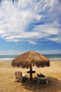 ocean tropical beaches handmade umbrellas with siilas without people in Mancora Peru