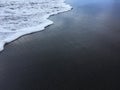 Pacific Ocean Waves with Dirt from Waimea River from Waimea Canyon at Waimea Beach on Kauai Island in Hawaii.