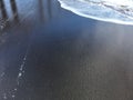 Pacific Ocean Waves with Dirt from Waimea River from Waimea Canyon at Waimea Beach on Kauai Island in Hawaii.