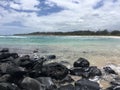 Pacific Ocean Waves and Lava Rocks at Kealia Beach on Kauai Island in Hawaii.