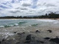 Pacific Ocean Waves and Lava Rocks at Kealia Beach on Kauai Island in Hawaii.