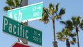 Pacific street road sign on crossroad, route 101 tourist destination, California, USA. Lettering on intersection signpost, symbol Royalty Free Stock Photo