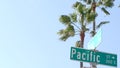 Pacific street road sign on crossroad, route 101 tourist destination, California, USA. Lettering on intersection signpost, symbol Royalty Free Stock Photo