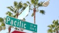 Pacific street road sign on crossroad, route 101 tourist destination, California, USA. Lettering on intersection signpost, symbol Royalty Free Stock Photo