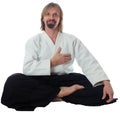 Pacification teacher of aikido sit on floor and pu