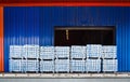 Pack of aluminum ingot bar stack on warehouse dock for container stuffing. Distribution warehouse and industrial raw material logi