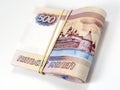 A pack of bills 500 rubles, tied with an elastic band. White background. Not isolated