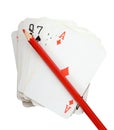 Pack of cards with red pencil, isolate on white (clipping path) Royalty Free Stock Photo