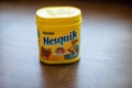 Pack of chocolate and cacao drink Nesquik by Nestle on wooden background