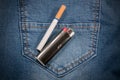 Pack of cigarettes and lighter in pocket jeans Royalty Free Stock Photo