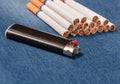 Pack of cigarettes and lighter in pocket jeans Royalty Free Stock Photo