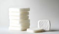 A pack of cotton pads and soap the right of the white on white background Royalty Free Stock Photo