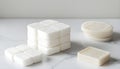 A pack of cotton pads and soap the right of the white on white background Royalty Free Stock Photo
