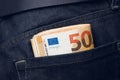 Pack of 50 euros in a jeans pocket close-up. Royalty Free Stock Photo