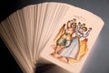 Pack of tarot cards with a Happiness card on top