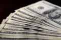 A pack of hundred dollar bills on a dark background Royalty Free Stock Photo