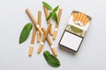 Pack of menthol cigarettes and fresh mint on colored table, Menthol cigarettes top view flat lay Royalty Free Stock Photo