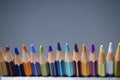 A pack of multicolored pencils on a dark gray background Royalty Free Stock Photo