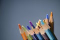 A pack of multicolored pencils on a dark gray background Royalty Free Stock Photo