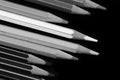 A pack of pencils on a dark background close-up. Black and white