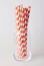 Pack of red and white striped disposable paper straws for party cocktails Royalty Free Stock Photo