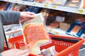 Pack of salmon in hand at store Royalty Free Stock Photo