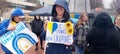 Pack Square in Ashville NC Peace activist hold signs calling for peace on One Year Anniversary of war in Ukraine