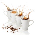 Pack of white mugs with coffee splash isolated on white background Royalty Free Stock Photo
