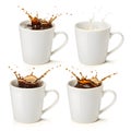 Pack of white mugs with coffee splash isolated on white background Royalty Free Stock Photo
