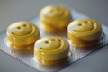 A pack of yellow pills with smiley faces on them Royalty Free Stock Photo