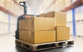 Package Boxes on Pallet with Electric Forklift pallet Jack Load at The Storage Warehouse. Storehouse, Shipping Warehouse Logistics Royalty Free Stock Photo