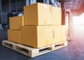 Package Boxes on Pallet with Electric Forklift Pallet Jack. Supply Chain Cargo Shipment Boxes Warehouse Logistics and Transport. Royalty Free Stock Photo